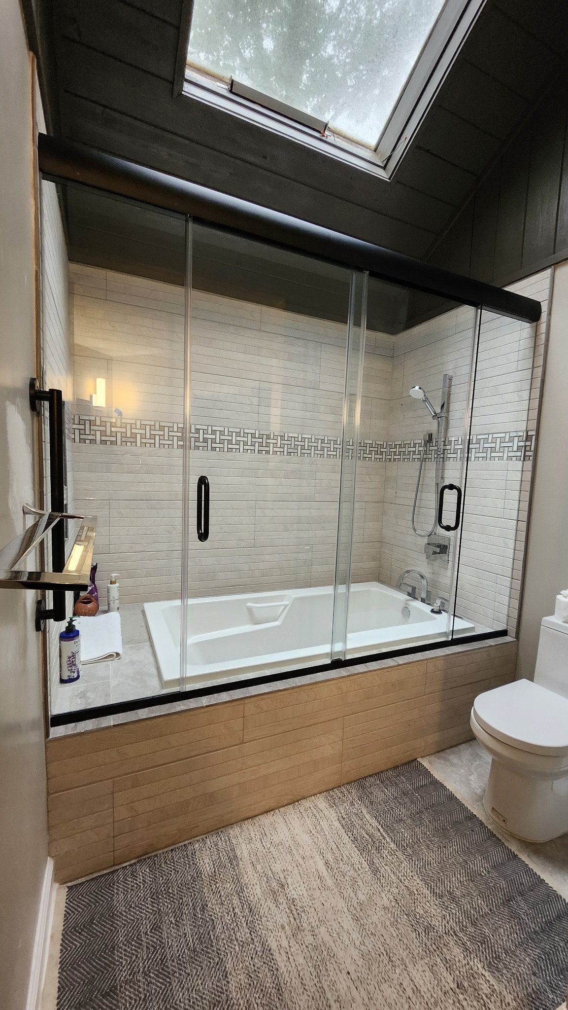 This is a double Cottage slider on a tub deck! Please note that we do not recommend or typically install glass outside of a drop in tub, however, this was a special circumstances requiring this specific glass placement.